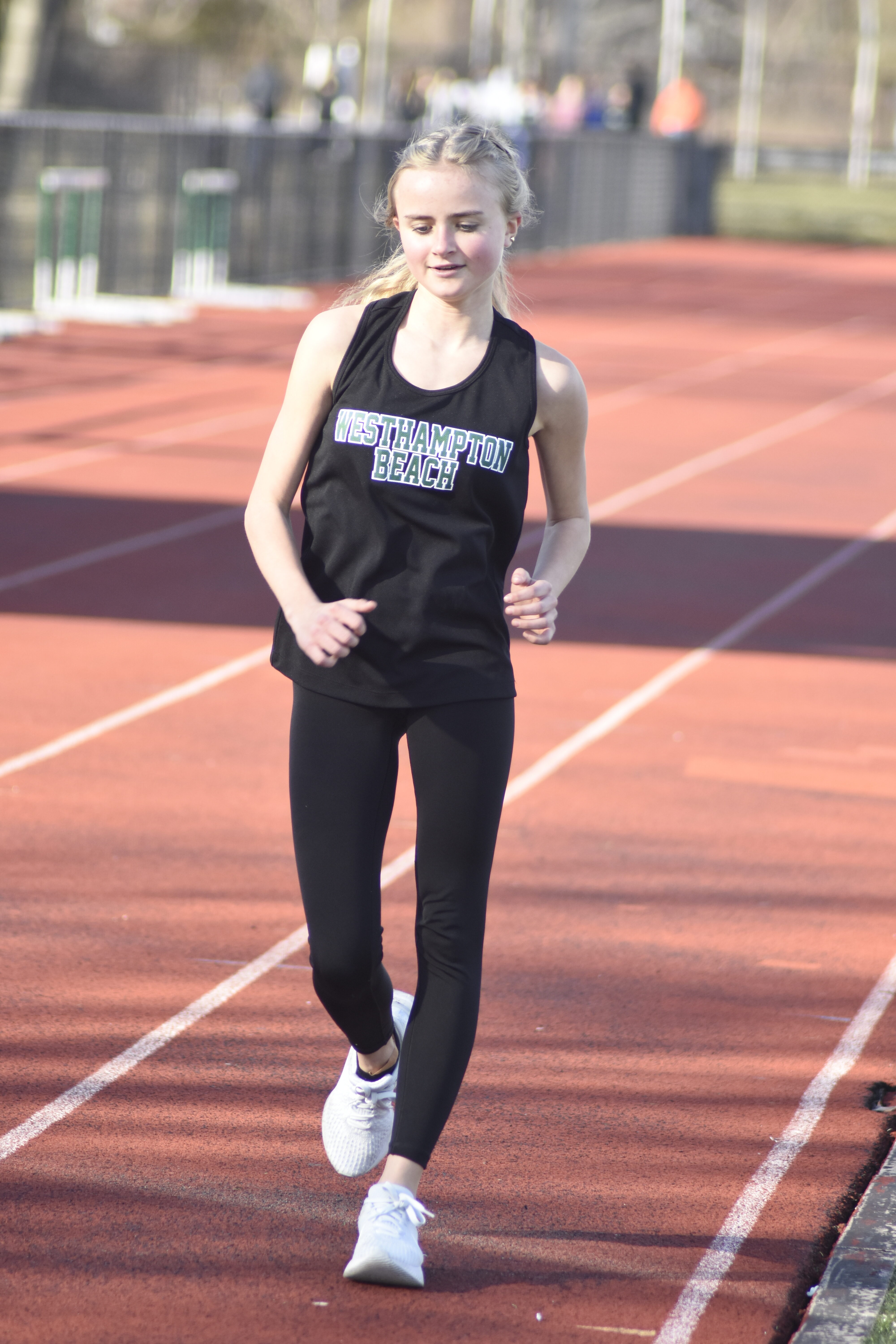 Ava Carvis in the 1,500-meter race walk on Friday.   DREW BUDD