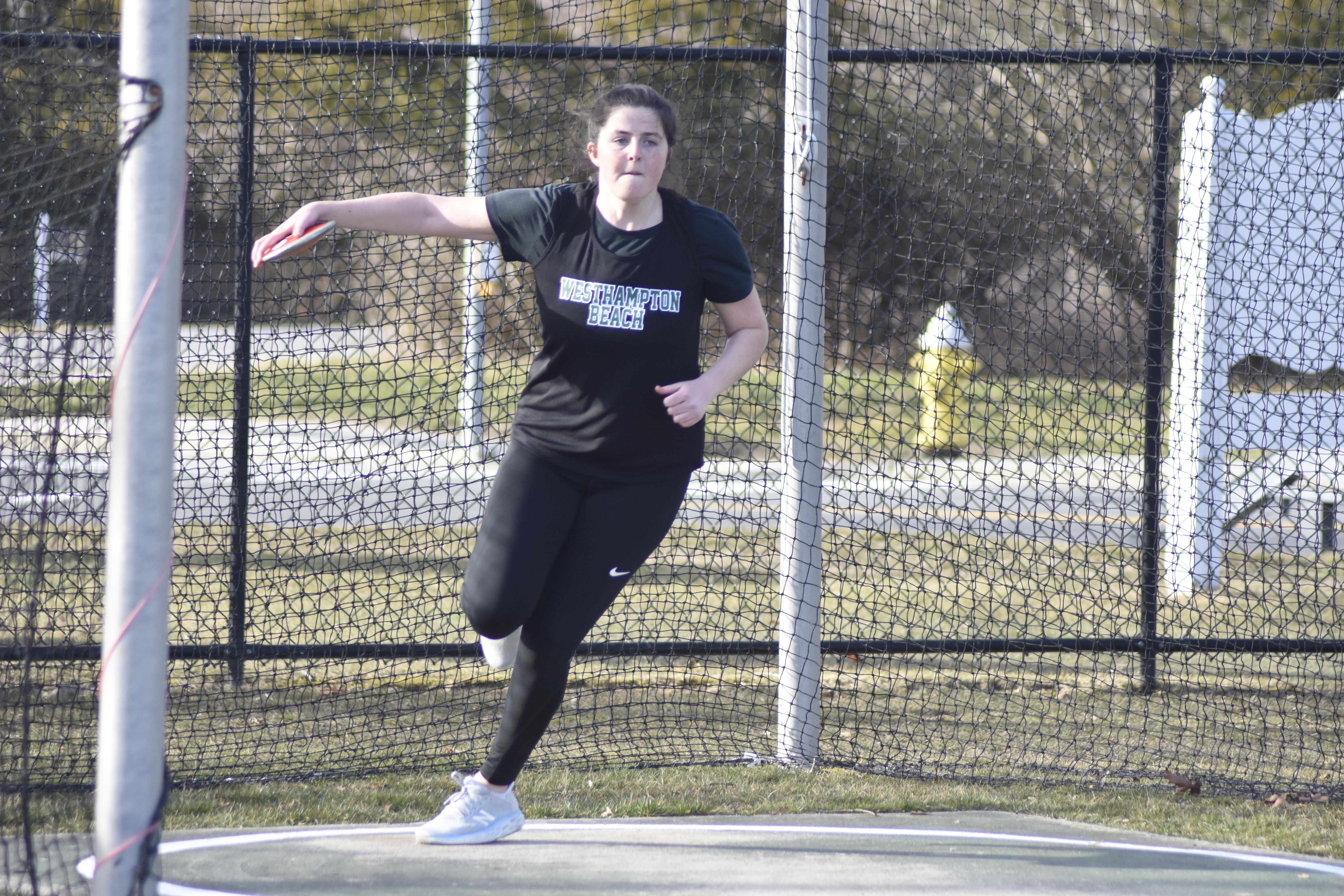 Kylie Way starts her approach in the discus.   DREW BUDD