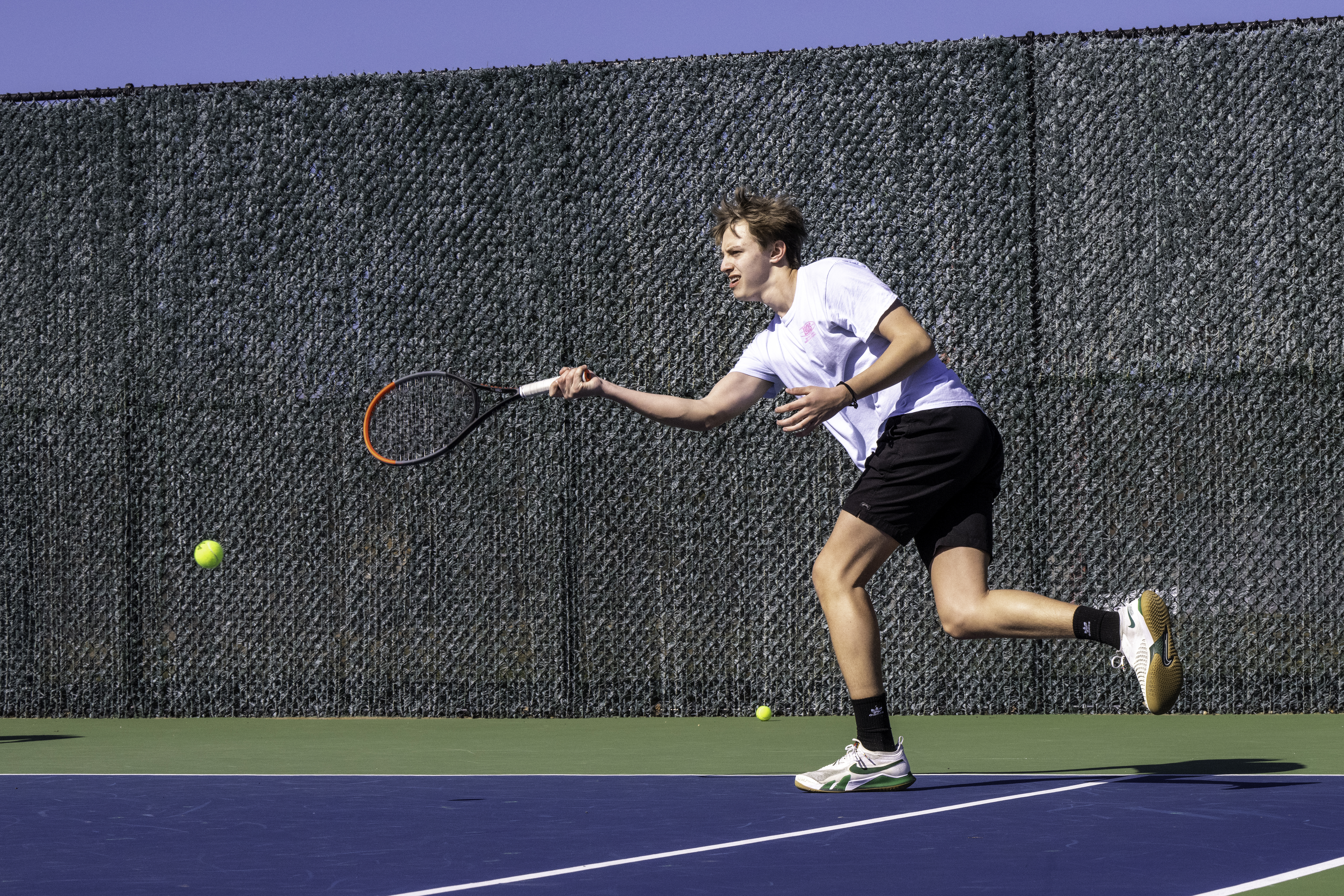 Pierson junior Chris Pilarski reaches for a return during practice Monday. MARIANNE BARNETT