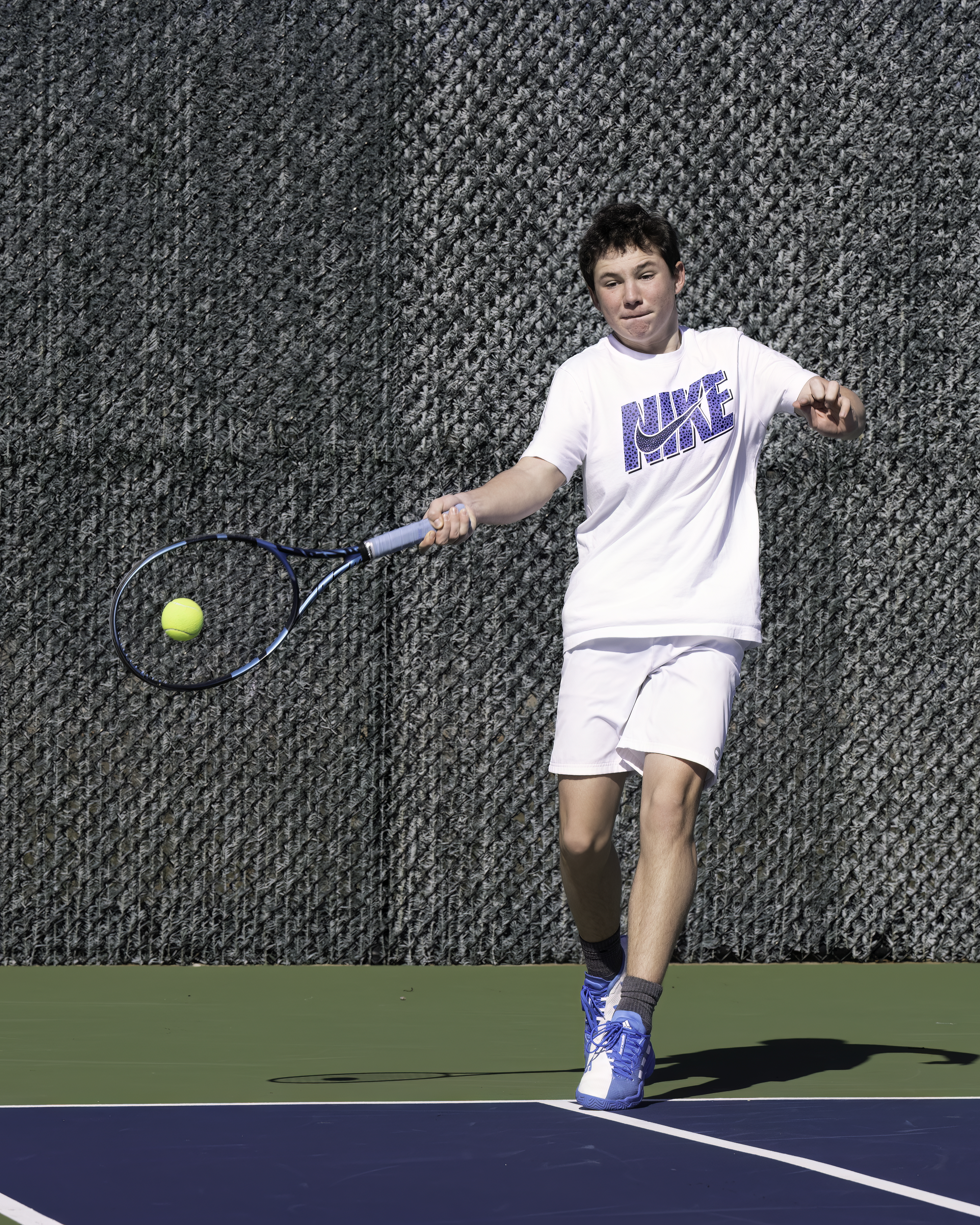 East Hampton freshman Henry Cooper rallies during practice Monday. MARIANNE BARNETT