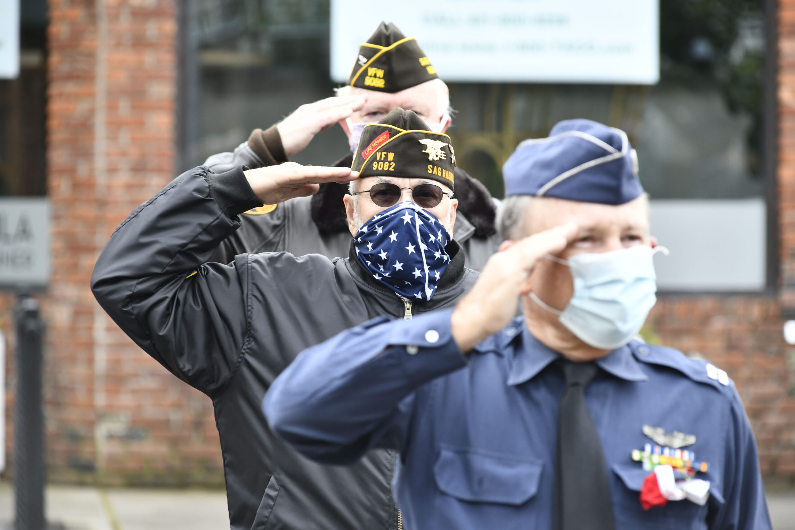 Masks became a common sight in everyday life. Attendees wearing masks at the Sag Harbor Memorial Day parade in May of 2020.  DANA SHAW