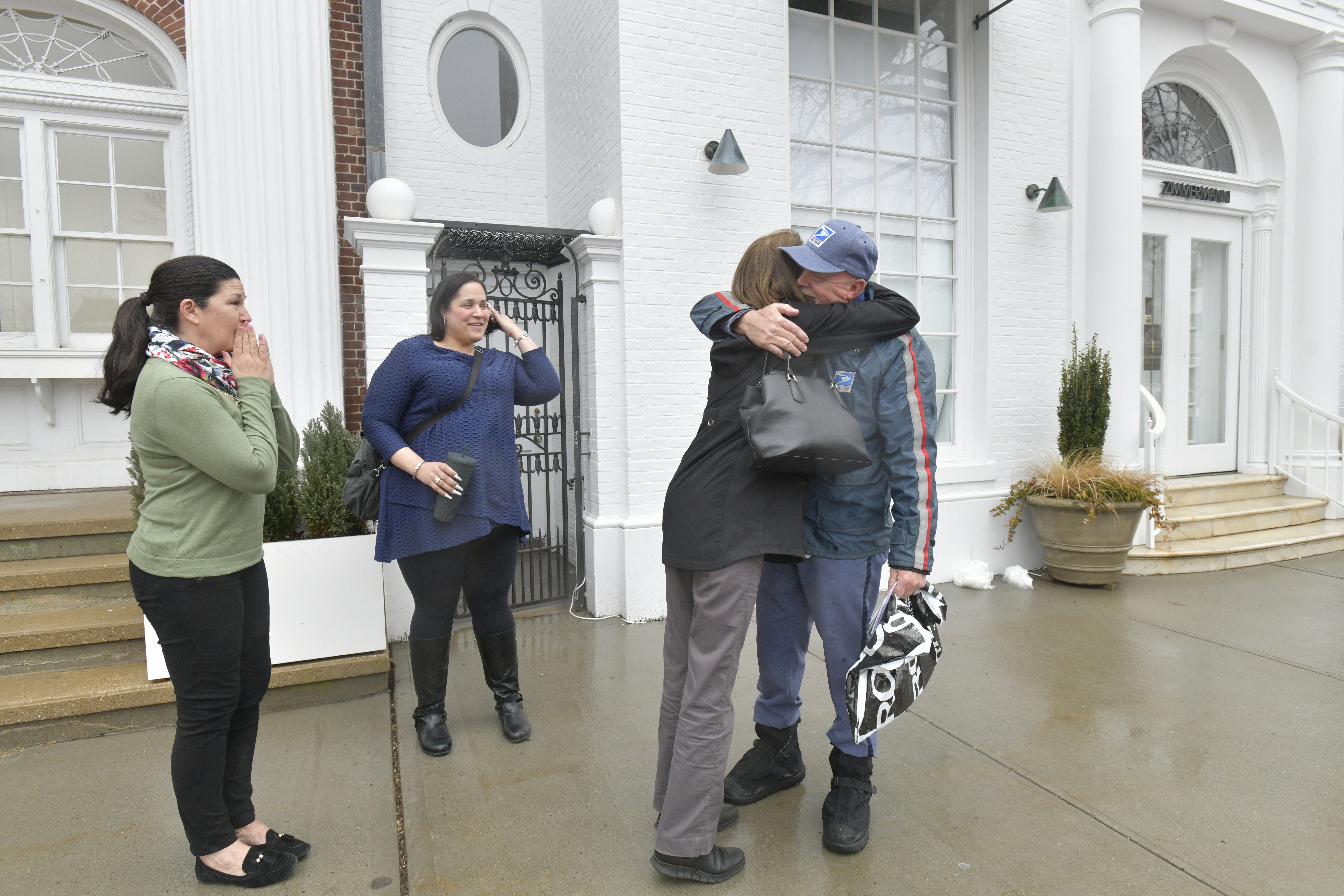 Jim Tuthill  gets a sendoff from Southampton Village employees on his route on his last day, February 28.  DANA SHAW