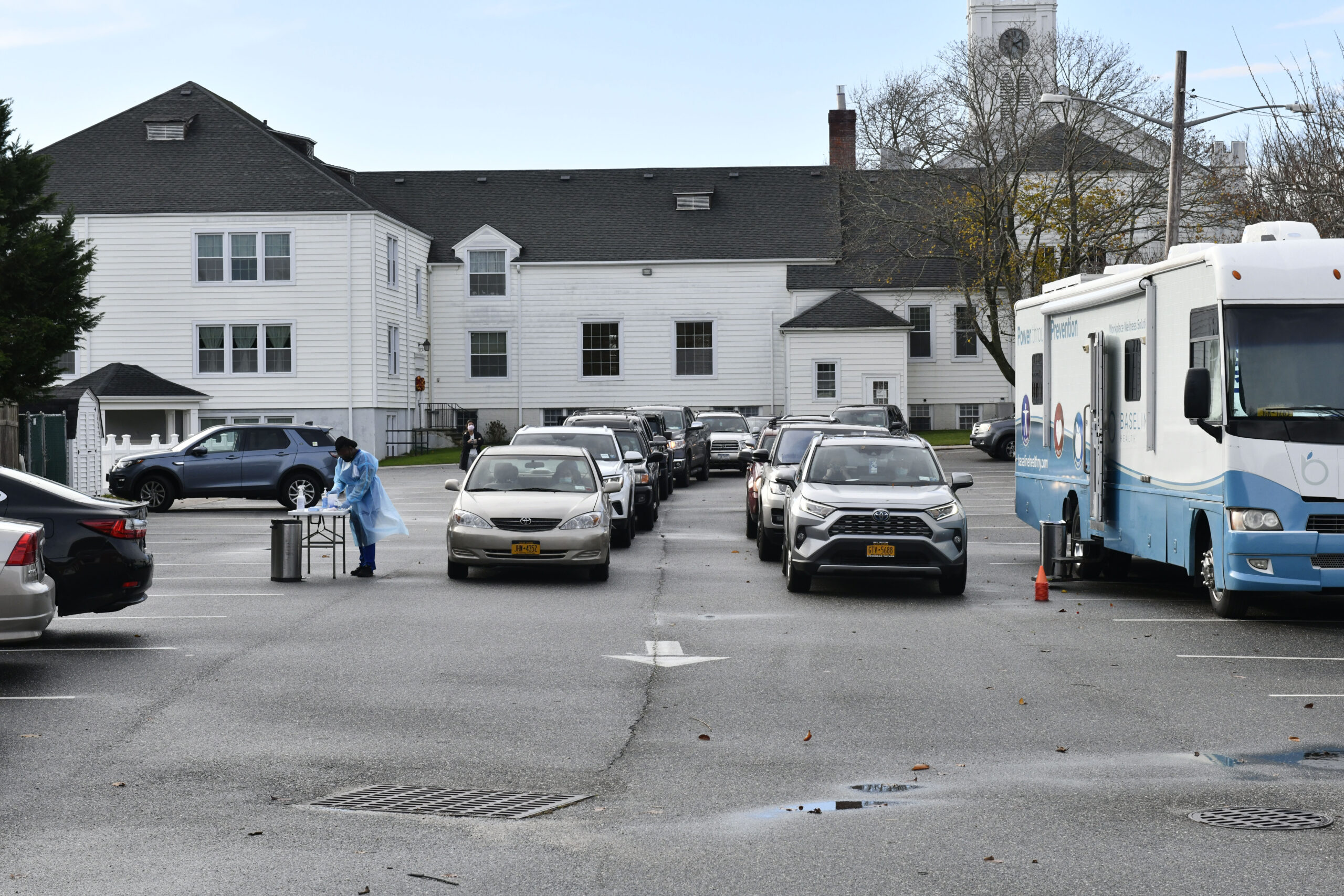 Lines for COVID 19 tests, sometimes stretching around the block, were a common sight on the East End during 2020.   DANA SHAW