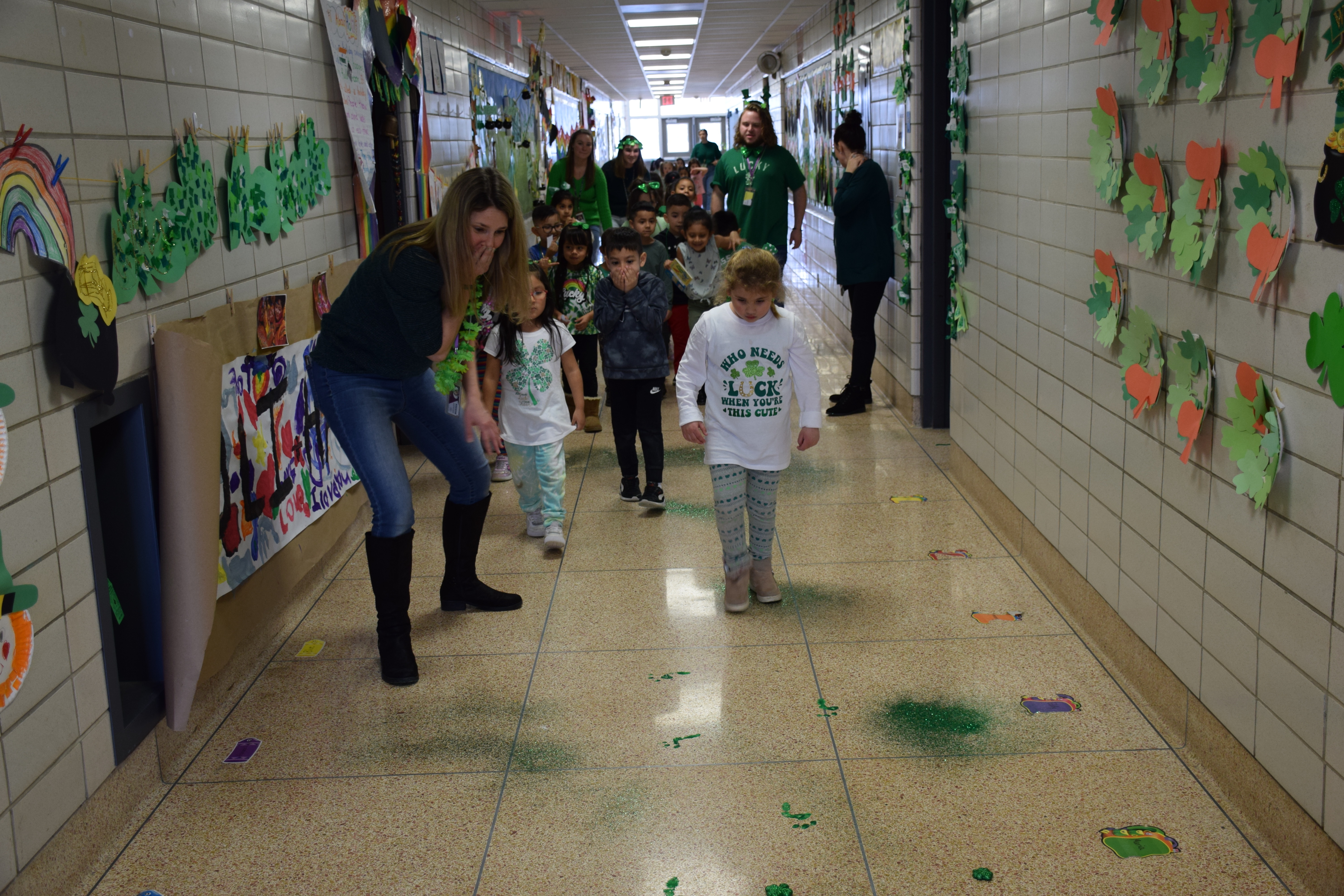 Dressed in green, Hampton Bays Elementary School kindergartners participated in St. Patrick’s Day-themed activities on March 17 and even tried to catch a leprechaun with traps that they designed at home. Despite setting their traps with bait, the leprechaun eluded them, leaving behind green glitter, footprints and a mess in their classrooms. Better luck next year. C OURTESY HAMPTON BAYS SCHOOL DISTRICT