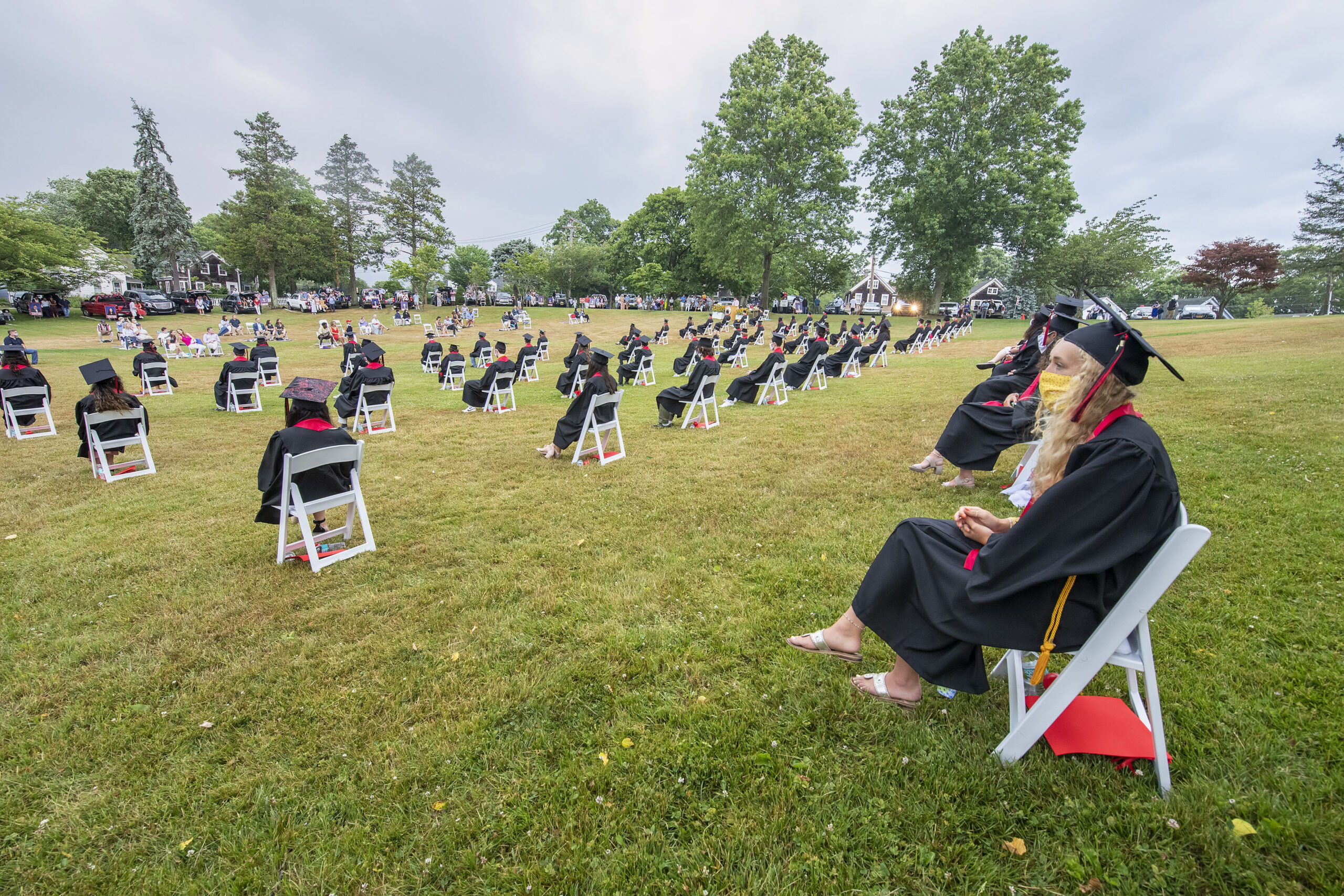 Senior Hallie Kneeland watches the proceedings during the Pierson High School 2020 Commencement Ceremony at Pierson High School on June 27, 2020. Students were seated at a safe distance from each other due to COVID 19.  MICHAEL HELLER