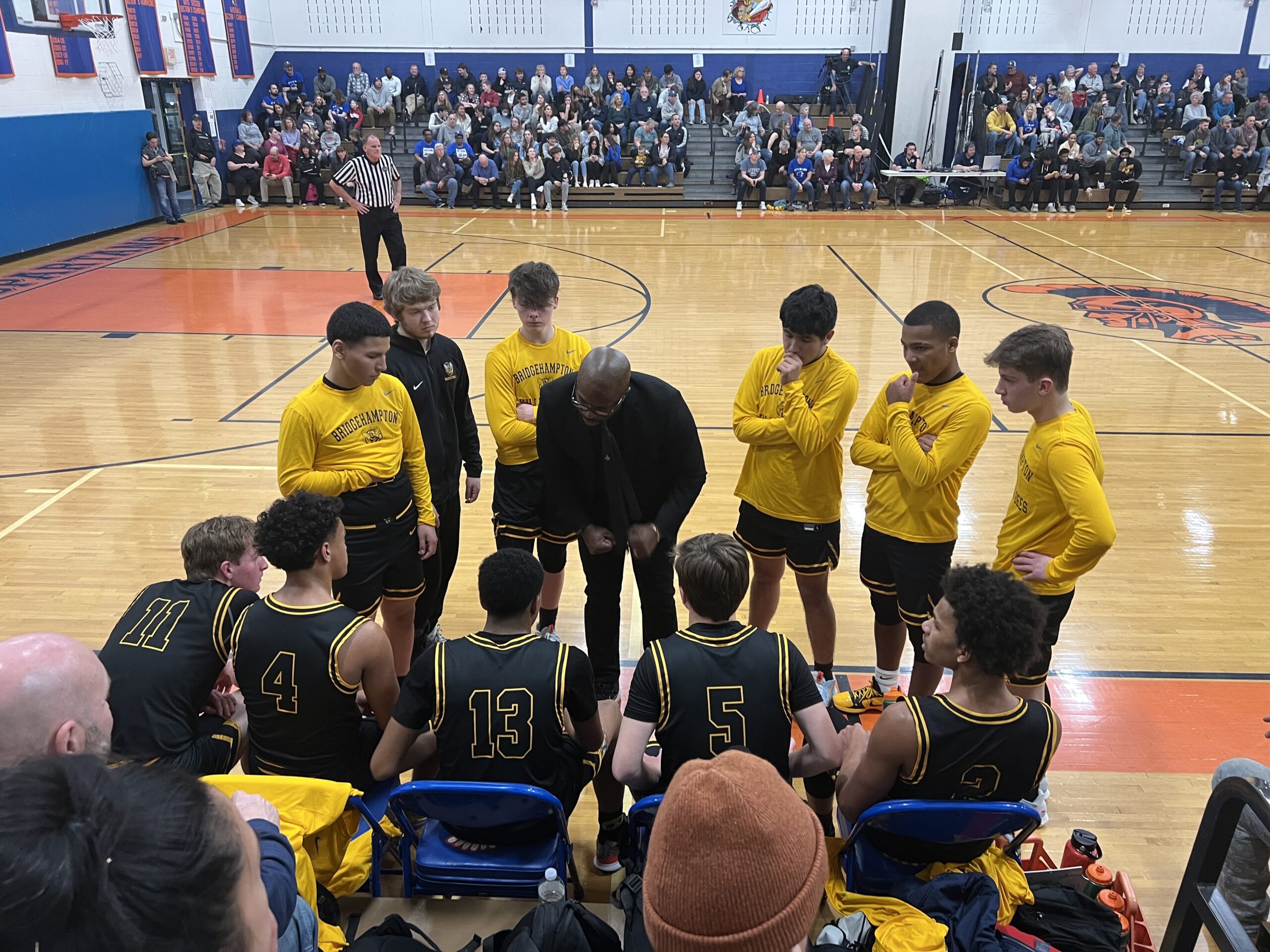 Bridgehampton head coach Ron White rallies his boys basketball team during Tuesday night's Class D regional semifinal at S. S. Seward Institute in Florida, New York. CARLA LILLIE