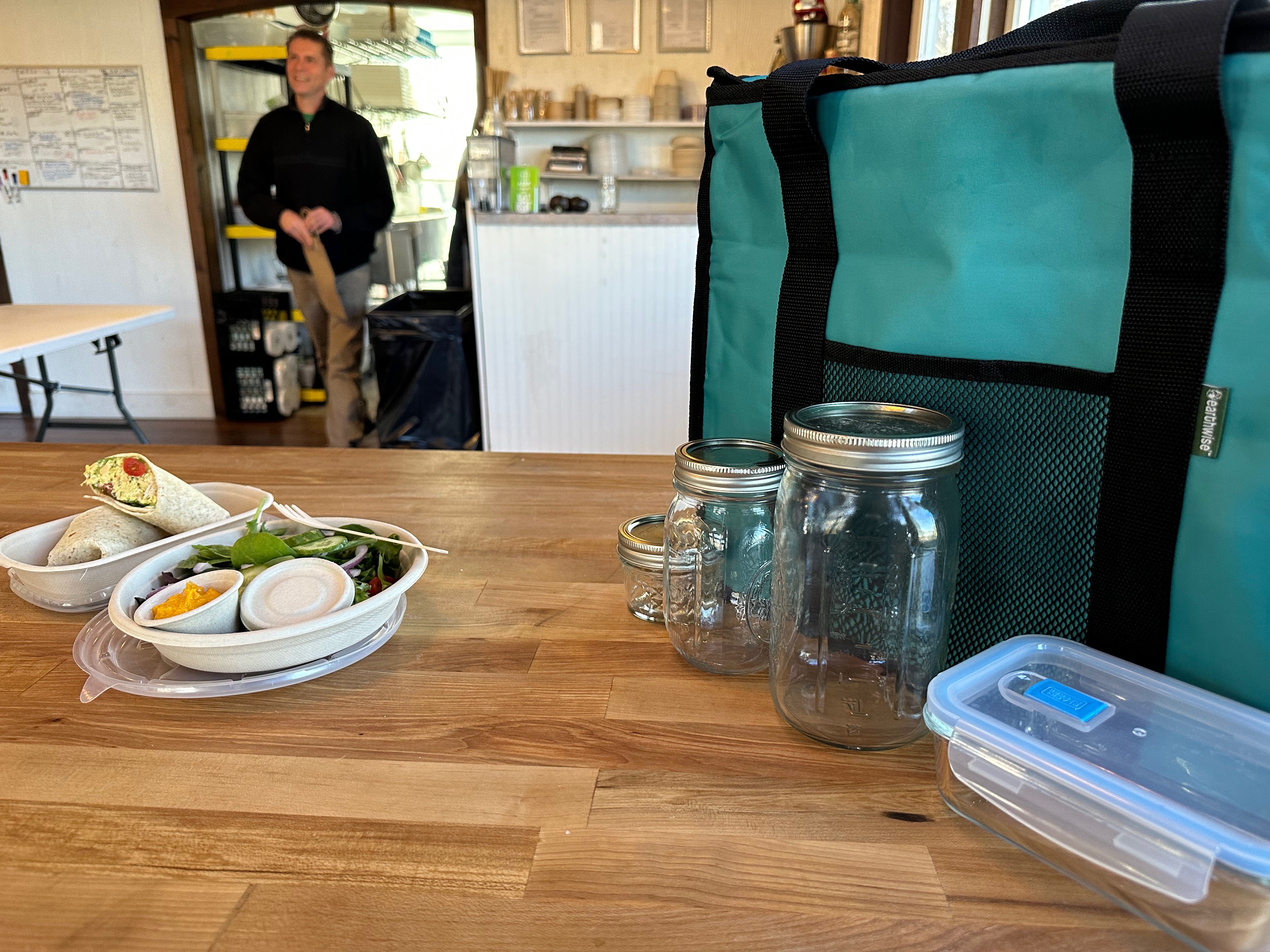 Chef Jon Albrecht, co-owner of Honest Plate, emerges from the prep area as an order gets ready for delivery. ANNETTE HINKLE