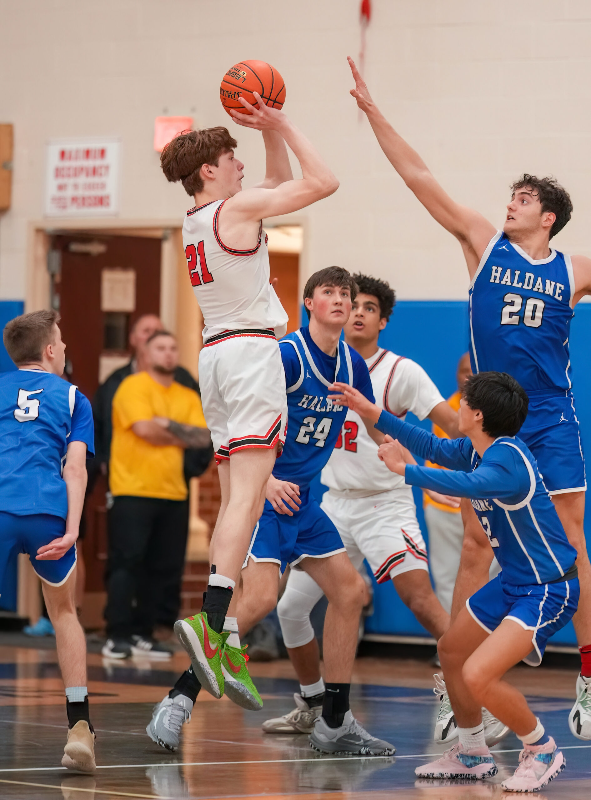 Junior Whaler Luke Seltzer shoots over Haldane senior Matteo Cervone.   RON ESPOSITO