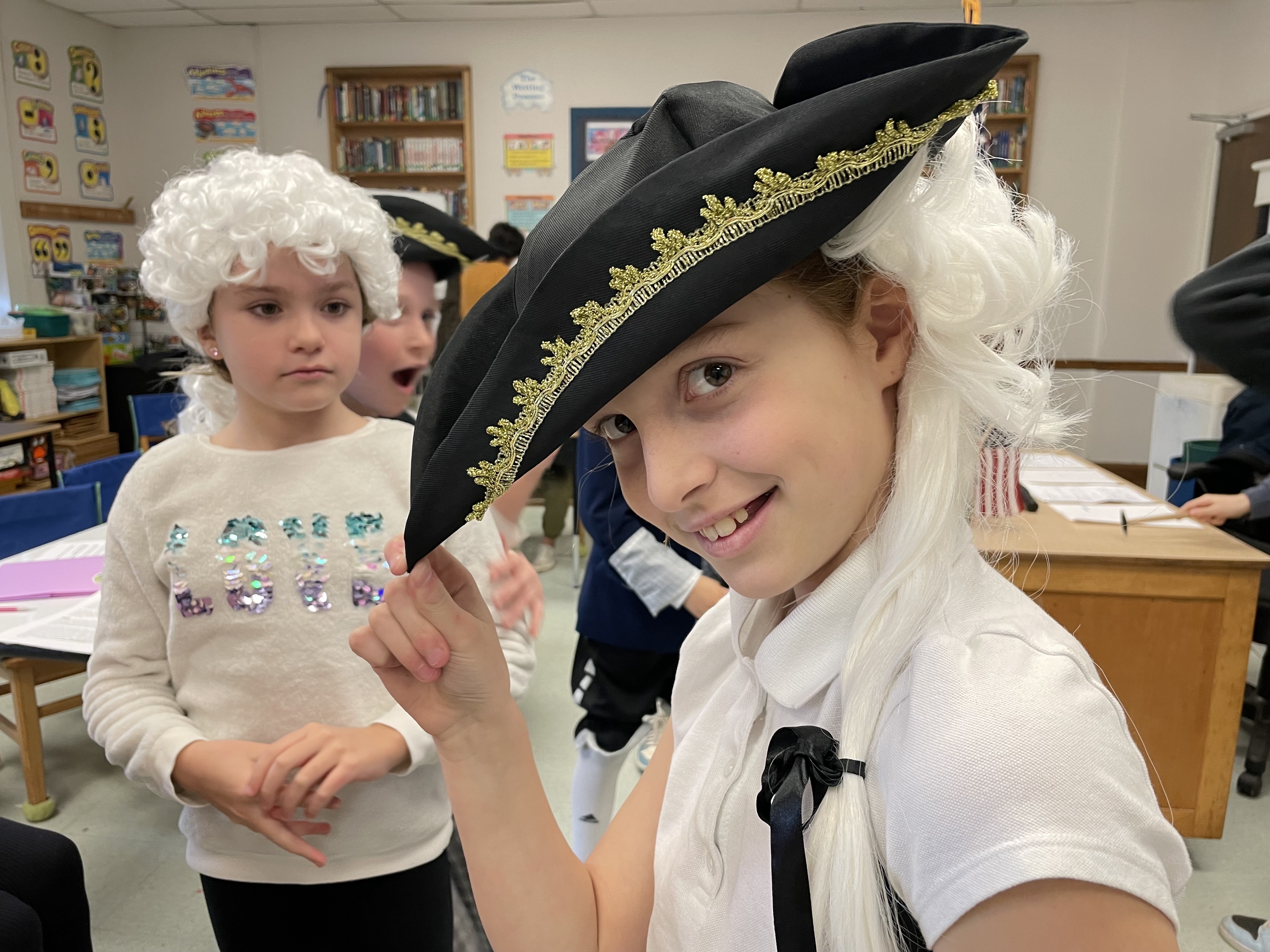 Sag Harbor Elementary School fourth grade students Evelyn Rizzo and Teagan Mott, in Jeff Reed’s class sport their wigs and continental hats as part of their mock trial against Peter Stuyvesant. COURTESY SAG HARBOR SCHOOL DISTRICT