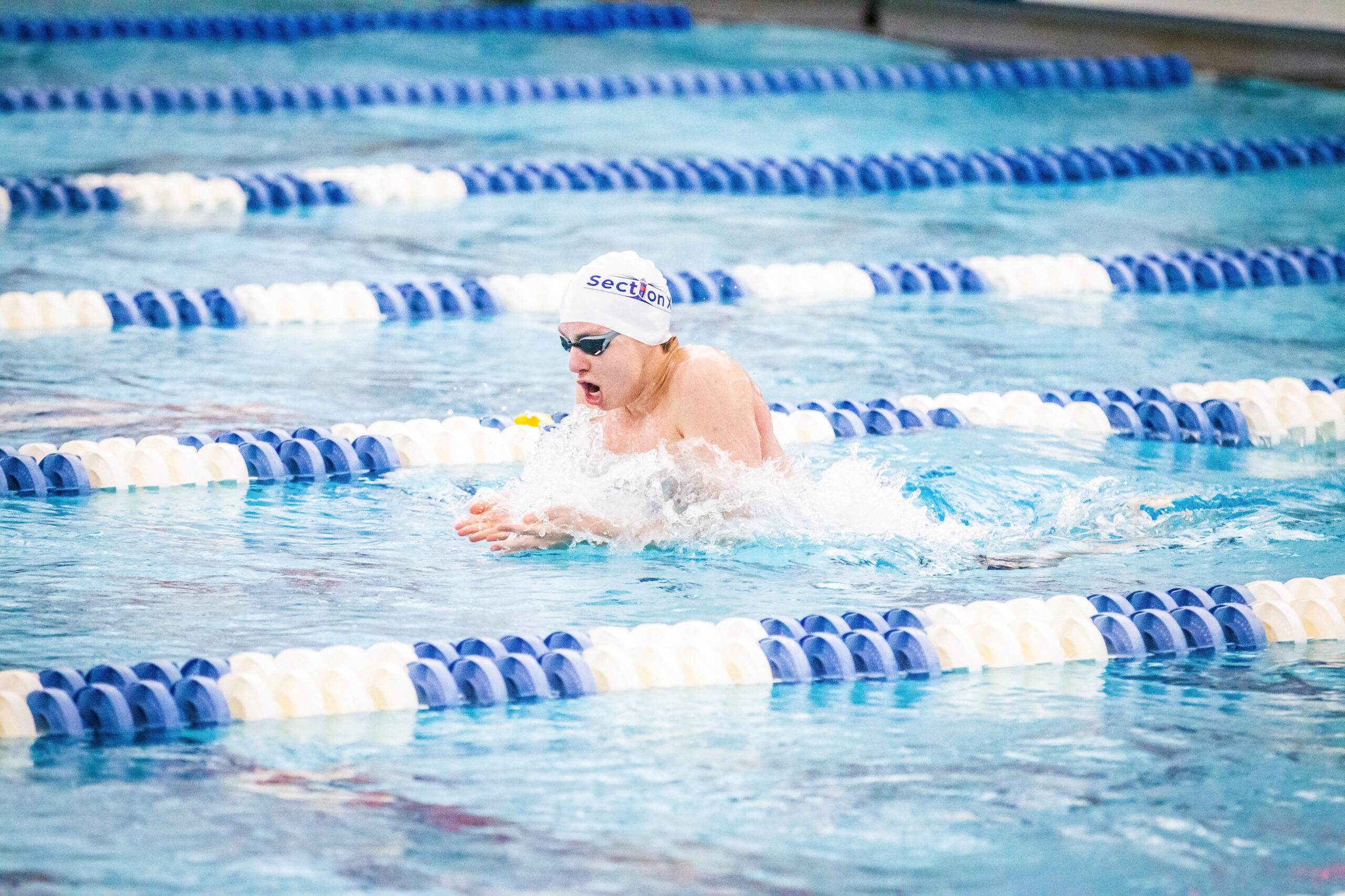 Westhampton Beach junior Max Buchen placed third among public school swimmers and fourth in the federation in the 100-yard breaststroke at the state championships March 3 and 4. DAVID WILLIAMS/BEYOND THE PRINT
