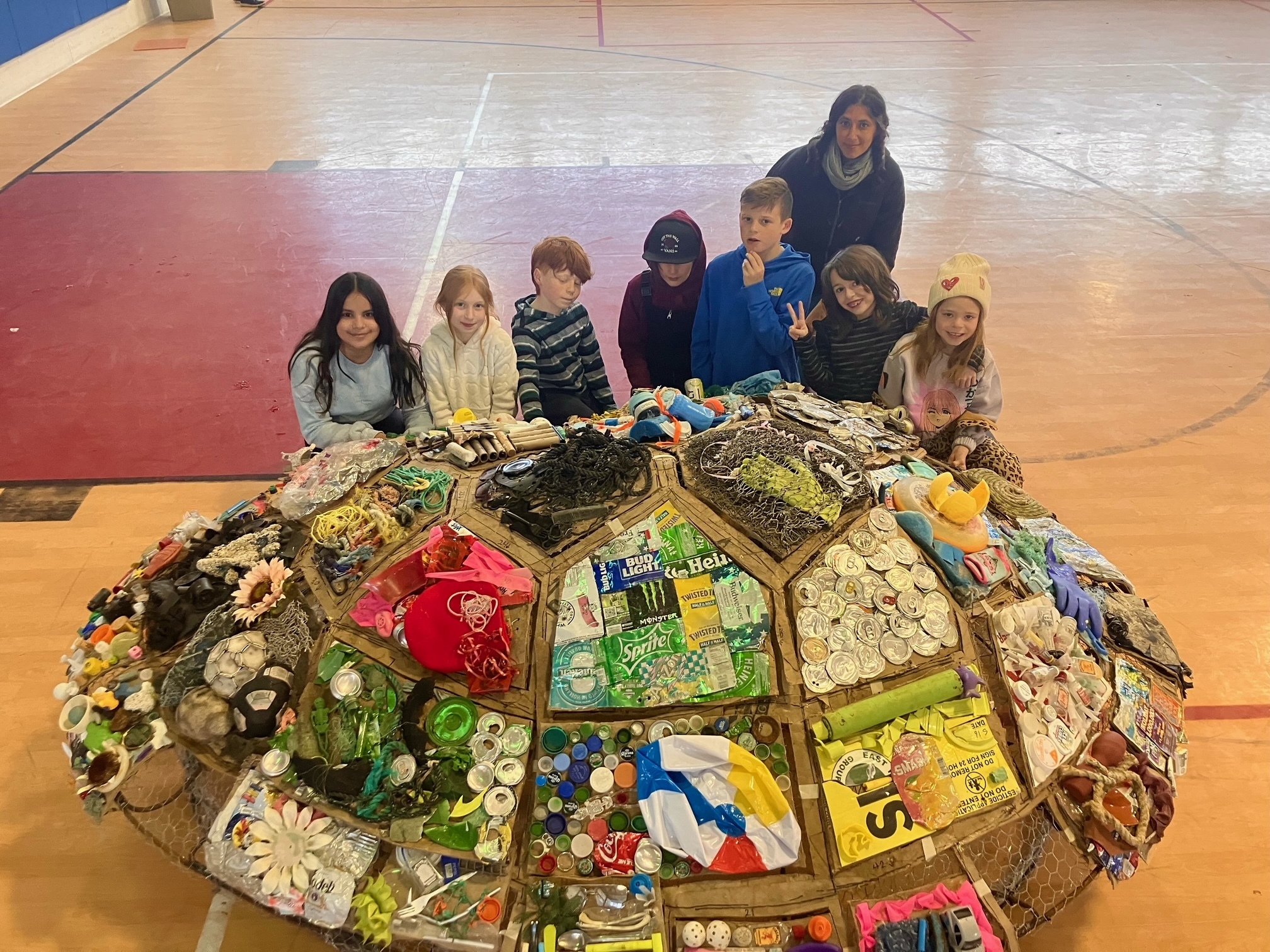 Students at the Hayground School created a sea turtle work of art, crafted from trash they collected at local beaches. It will be on display at the Parrish Art Museum on March 12.