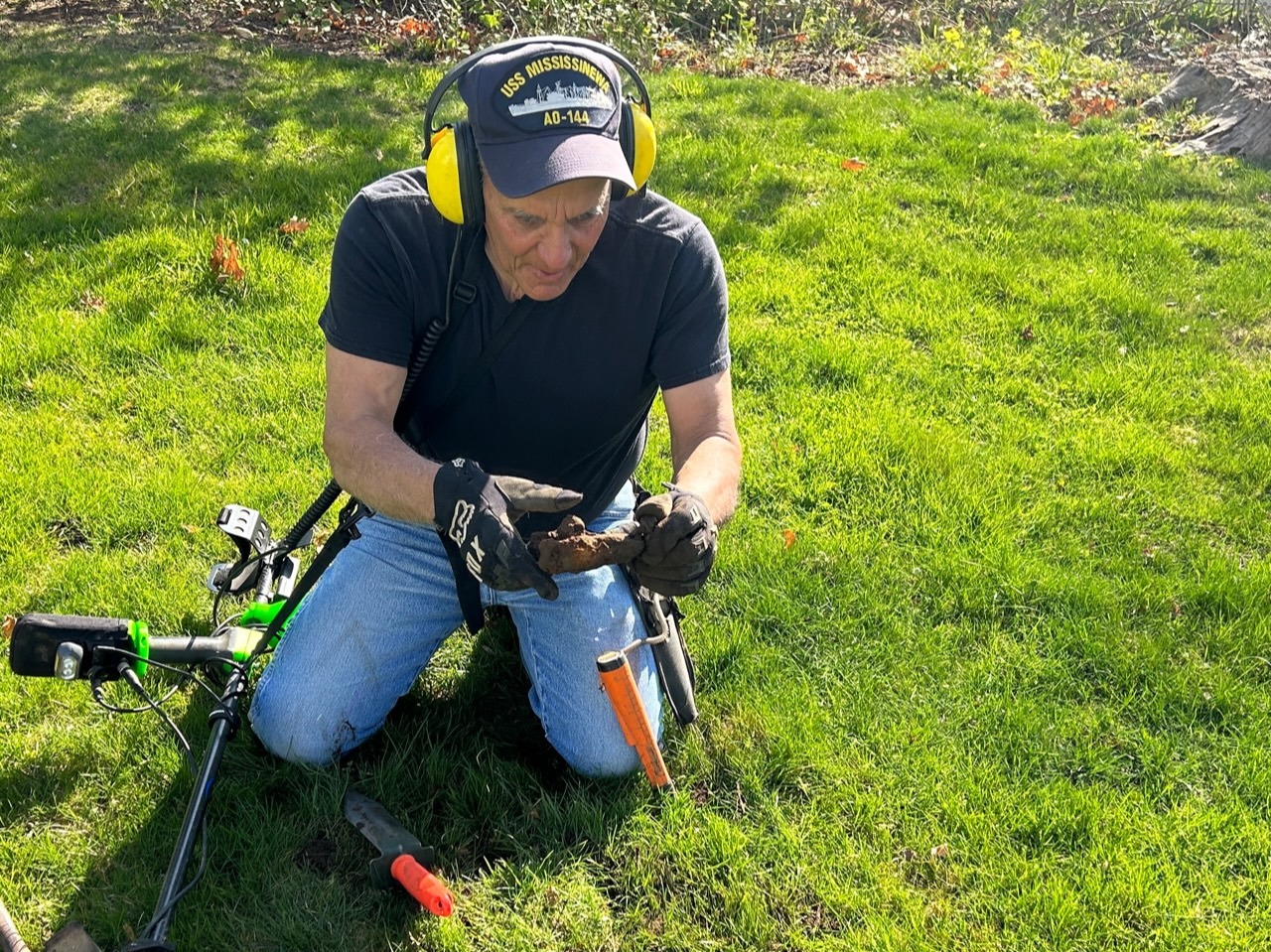 Metal Detectorist Begins Search for Buried Treasure at Remsenburg