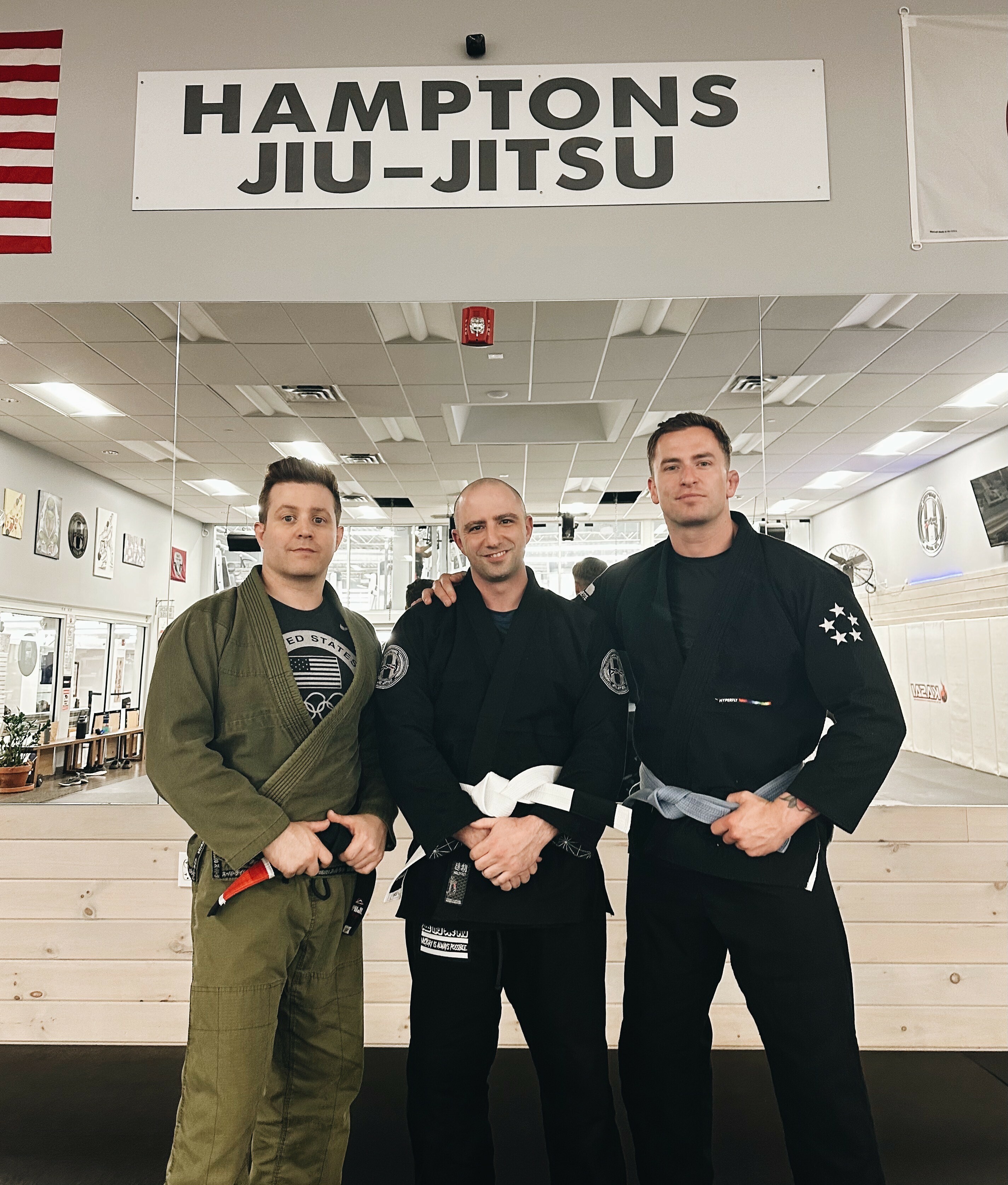 Greg Melita, left, with East Hampton Town Police Officer Dan Habe, who was the first to commit to the new program, and Luke McNamara.