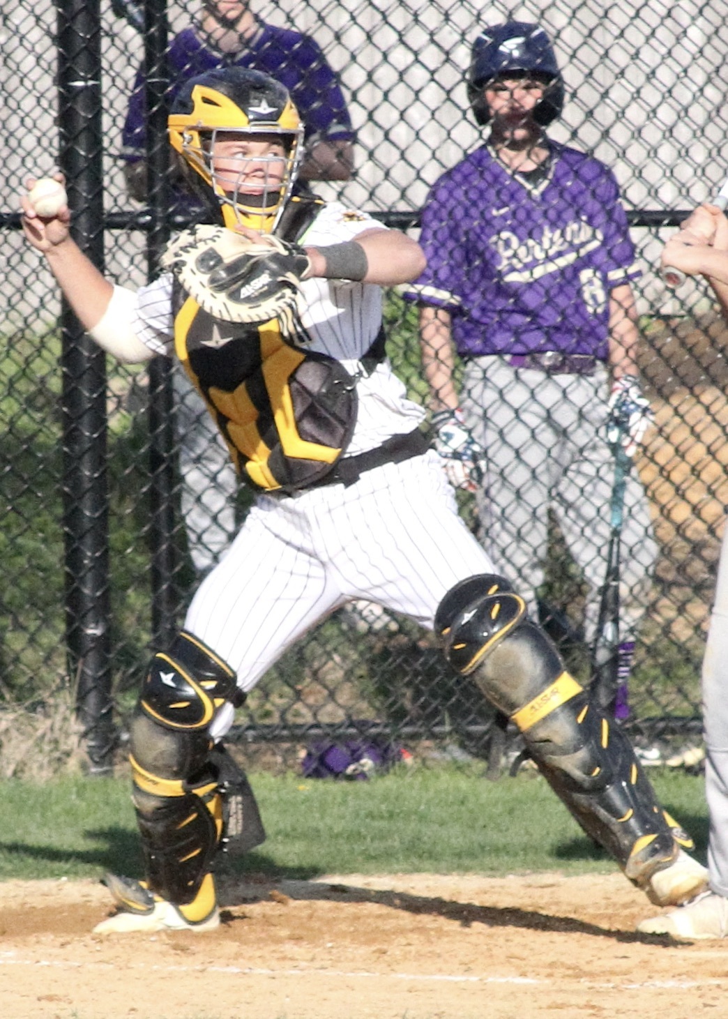 Ross junior Milo Tompkins tosses the ball to second from behind the plate. DESIRÉE KEEGAN