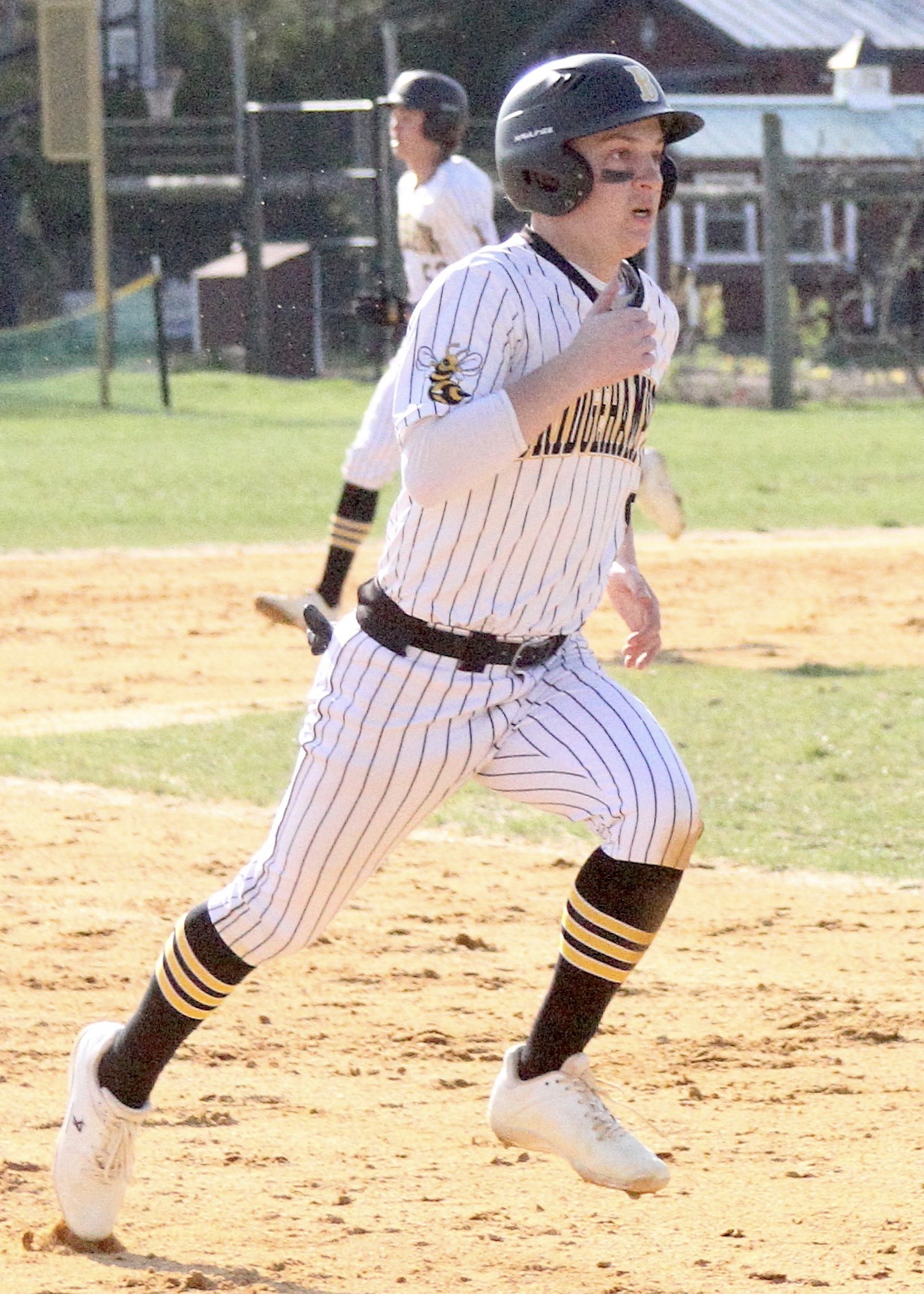 Bridgehampton senior Scott Vinski rounds second. DESIRÉE KEEGAN