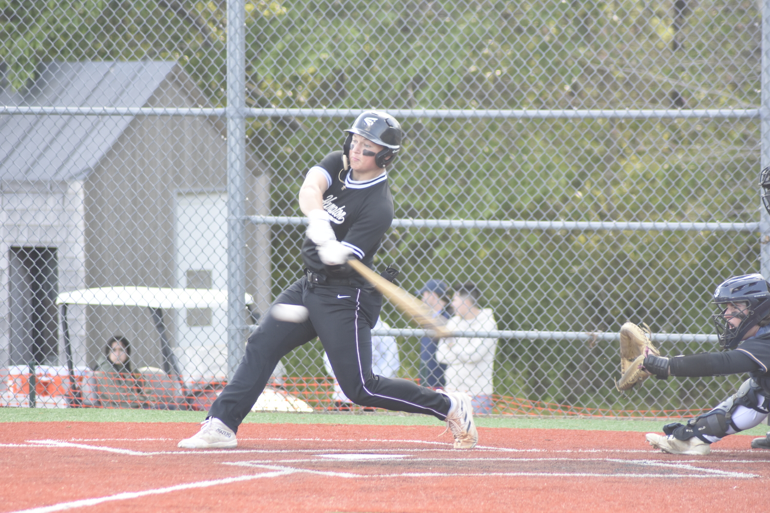 East Hampton senior Will Darrell sent this pitch to deep left field for a double to get the offense rolling on May 17.    DREW BUDD