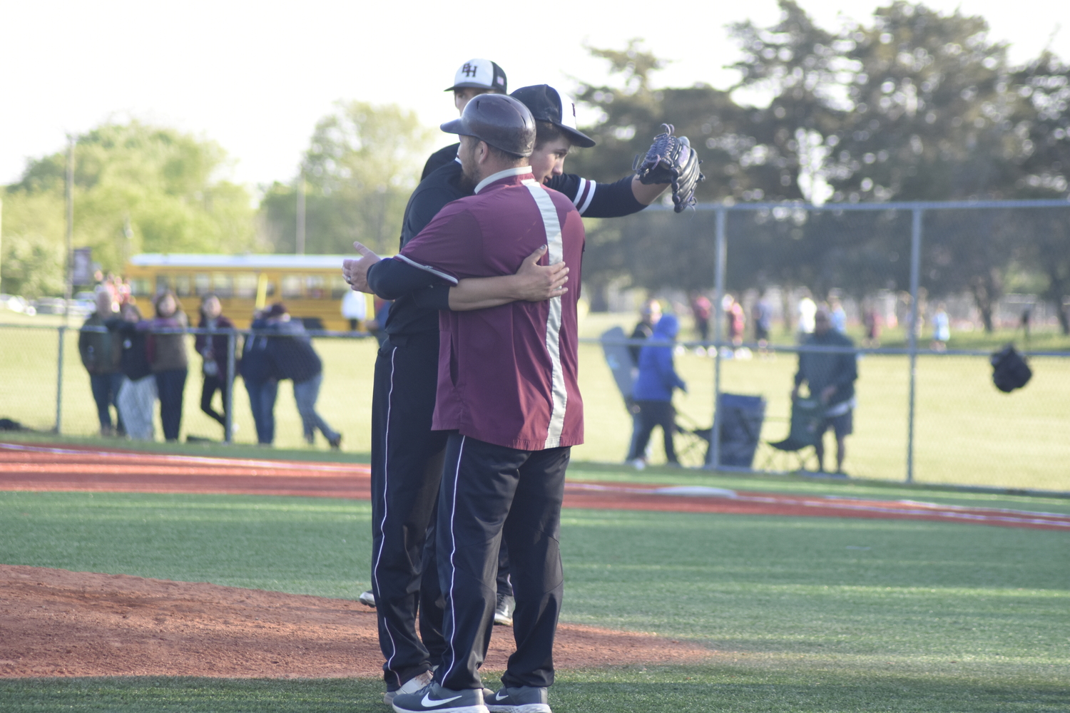 Jack Dickinson gets a big hug from head coach Vinny Alversa.   DREW BUDD
