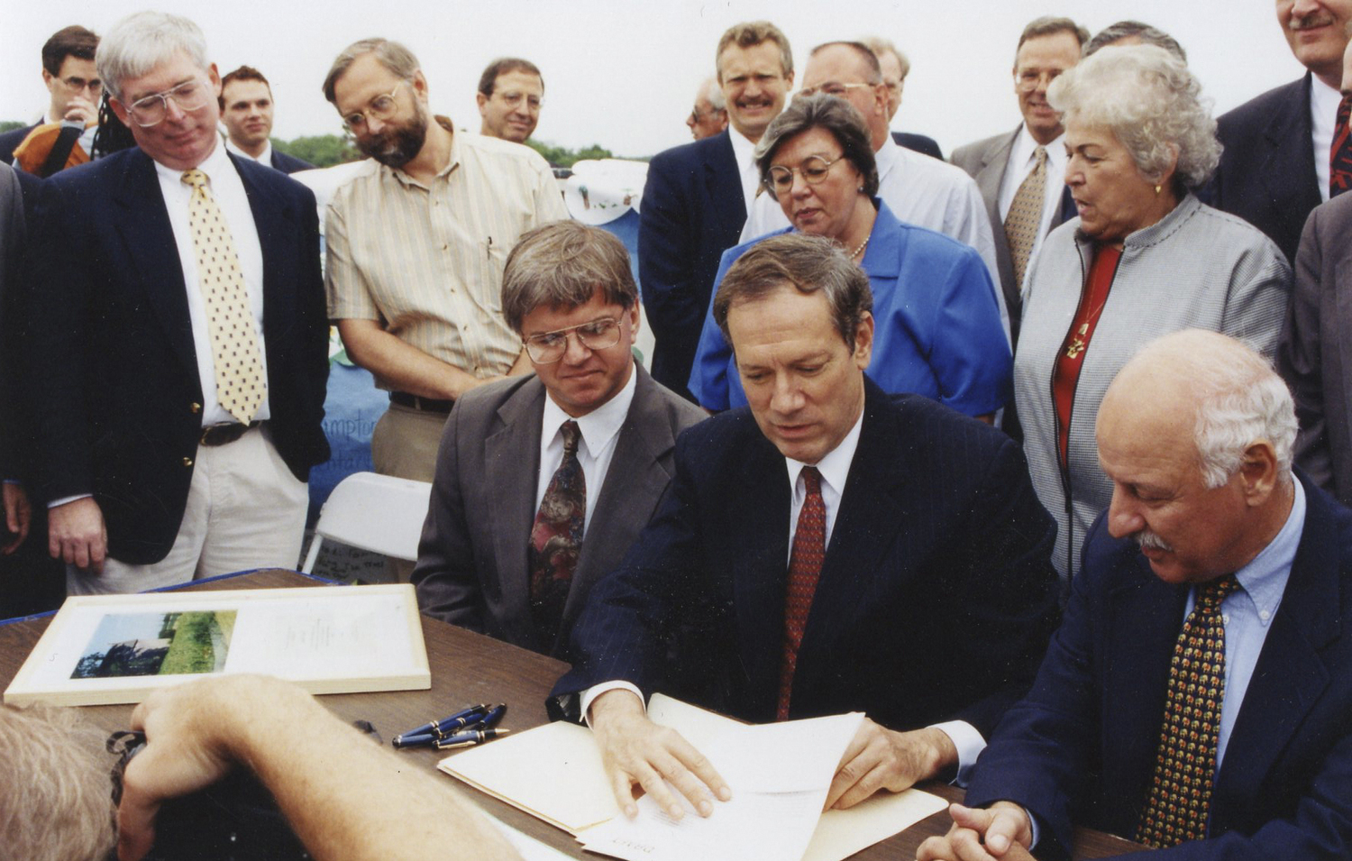 John v.H. Halsey, standing, second from left, at the signing of the Community Preservation Fund legislation in 1998.   COURTESY PECONIC LAND TRUST