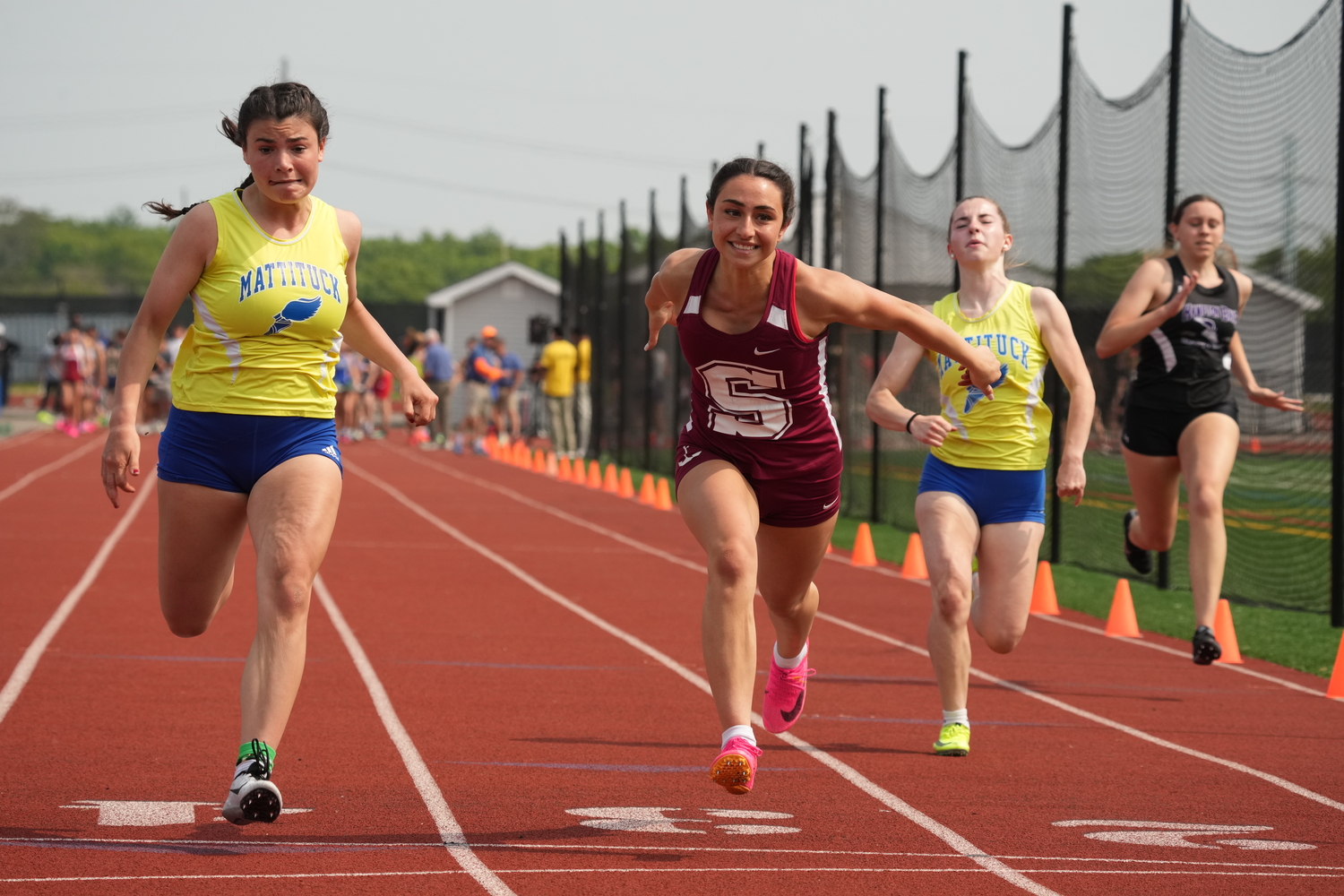 Southampton junior Kyla Cerullo lunges forward to place fourth in the 100-meter dash on Monday.   RON ESPOSITO