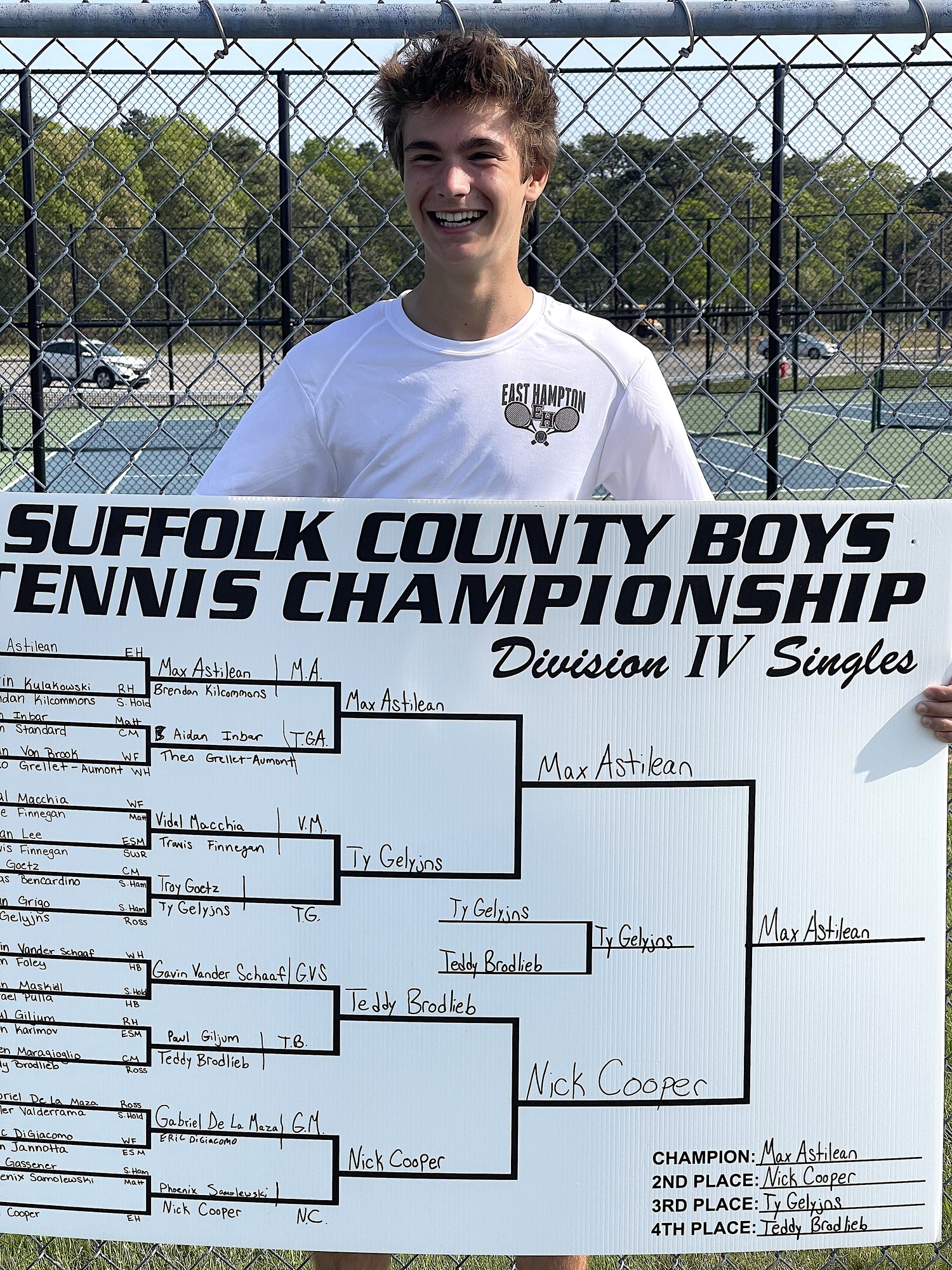 East Hampton senior Max Astilean with his winning singles bracket. DESIRÉE KEEGAN