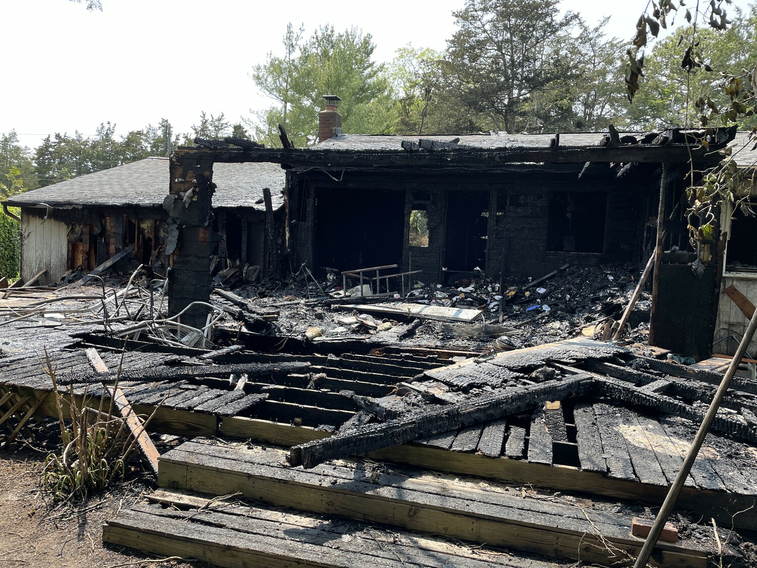 The aftermath of the fire that destroyed a home on Shore Road in Remsenburg on May 24.    COURTESY EASTPORT FIRE DEPARTMENT