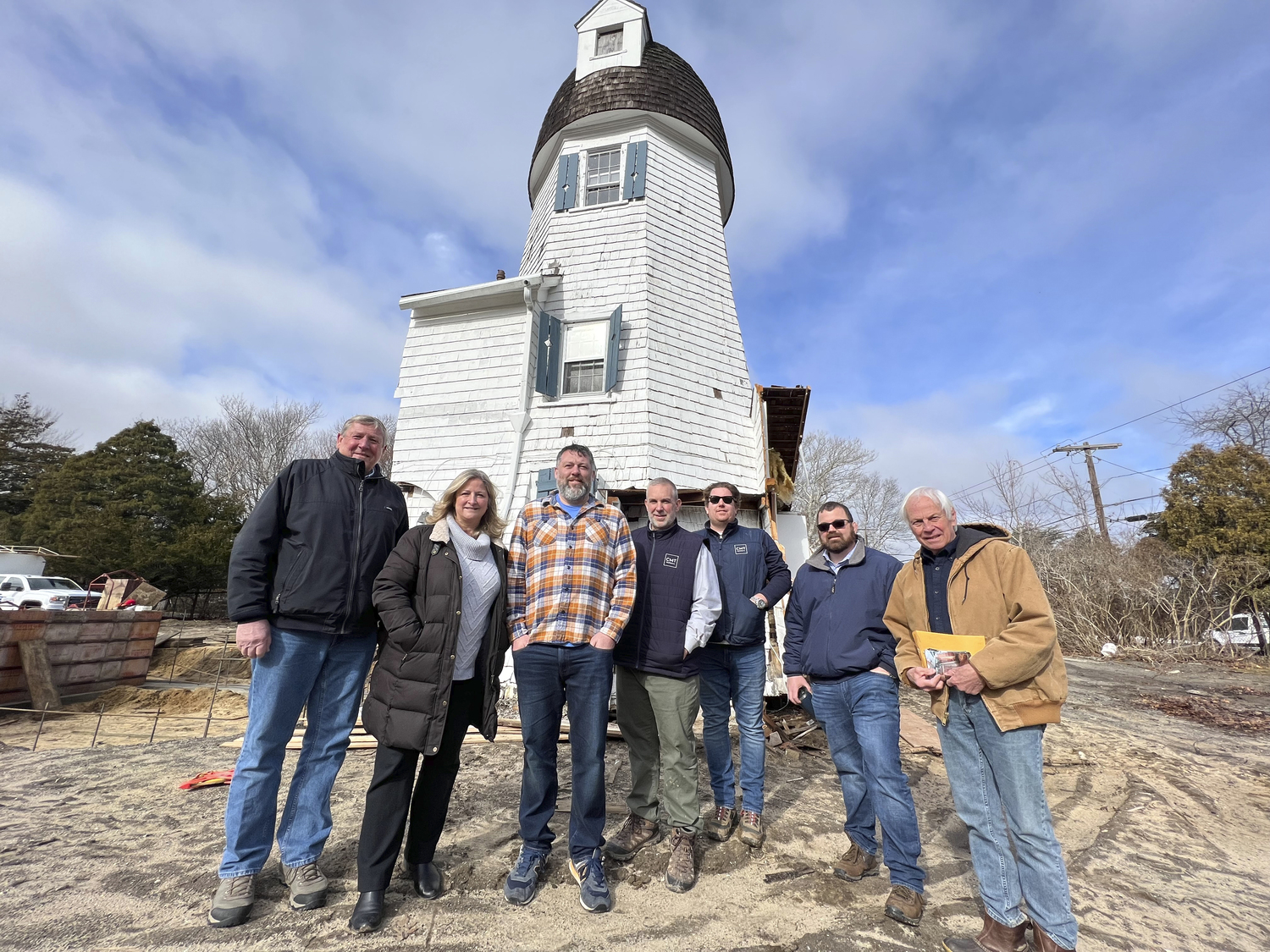 Westhampton Beach Village Deputy Mayor Ralph Urban, Mayor Maria Moore, Trustee Brian Tymann, CMT Builders Inc. owners Chris Truhn and Justin Schnepf, consultant Nick Bono, and Larry Jones at the Dix Windmill in Westhampton Beach in February 2022.
DANA SHAW