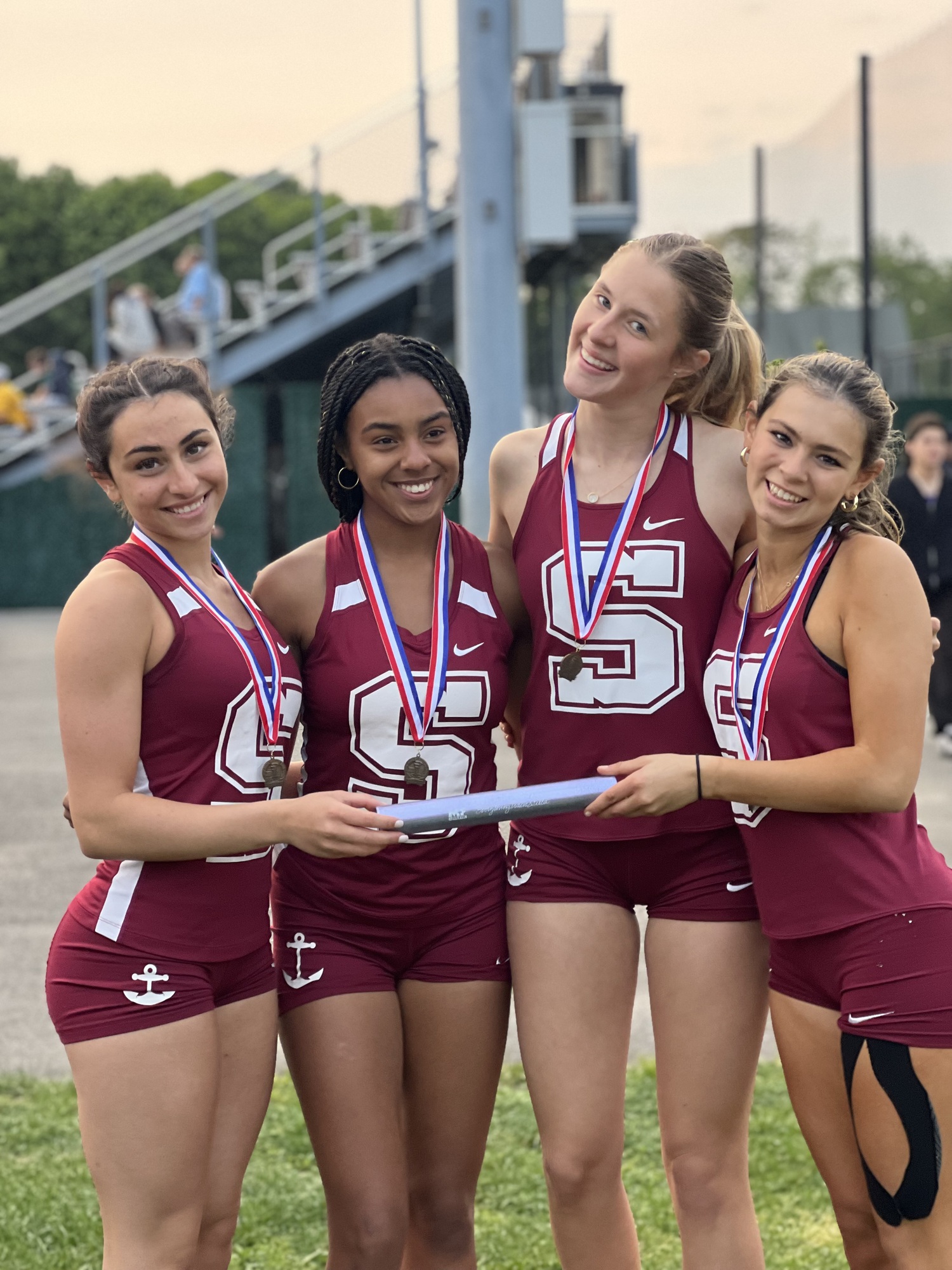 Southampton's 4x100-meter relay team of, from left, Kyla Cerullo, Diamond Brown, Emily Zukosky and Sophia Oliveri, were county champions on Monday.     AMY CERULLO