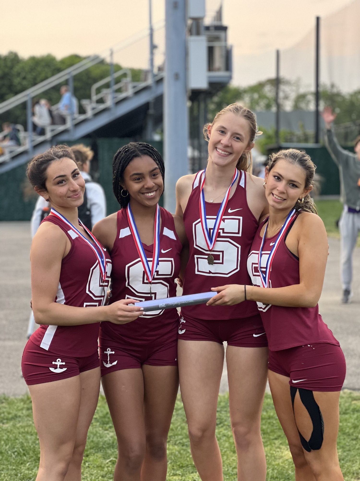 Southampton's 4x100-meter relay team of, from left, Kyla Cerullo, Diamond Brown, Emily Zukosky and Sophia Oliveri, were county champions on Monday.    AMY CERULLO