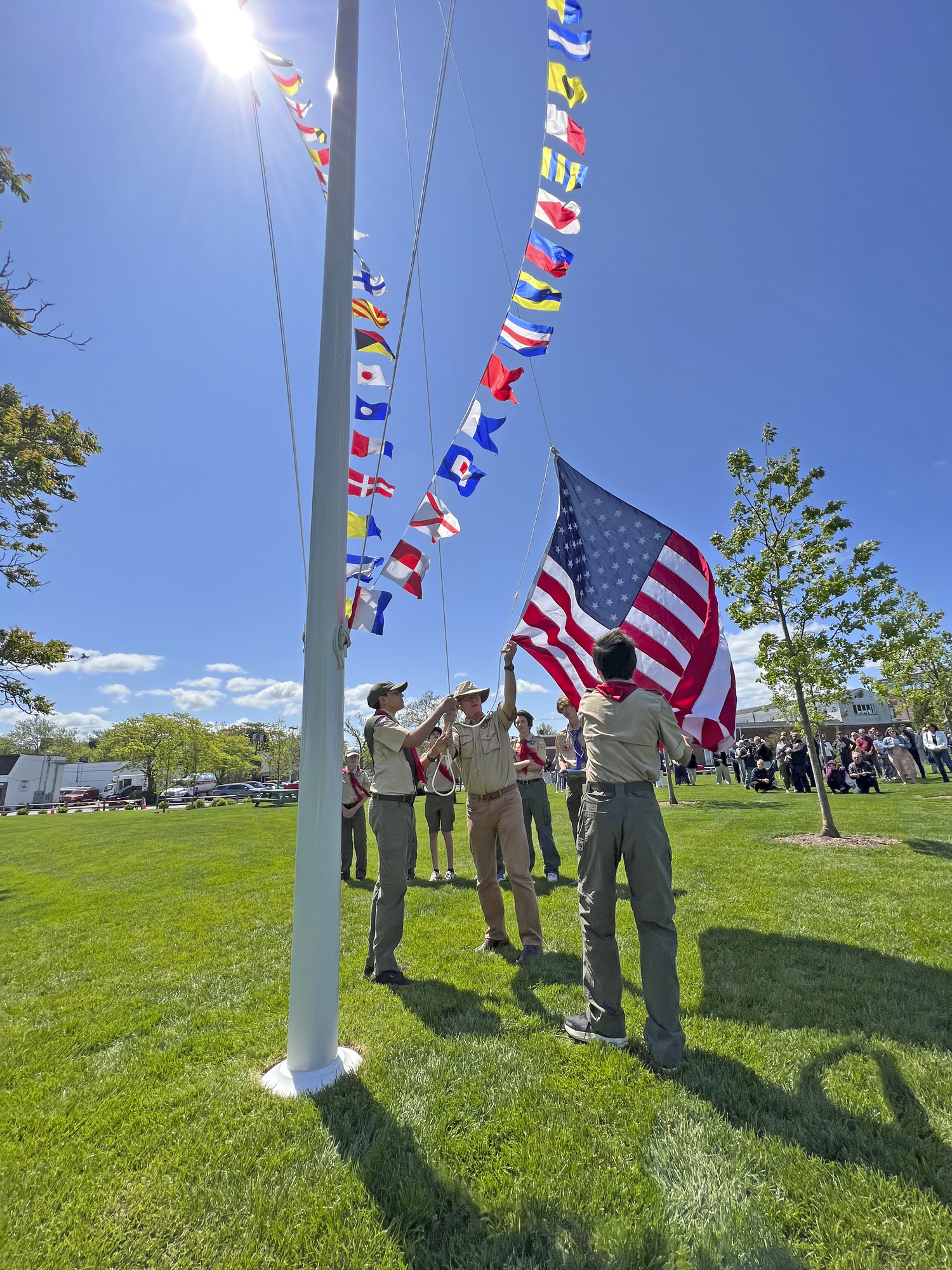 Members of Scout Troop 455 raise the flags for the first time in John Steinbeck Waterfront Park on Thursday.   DANA SHAW