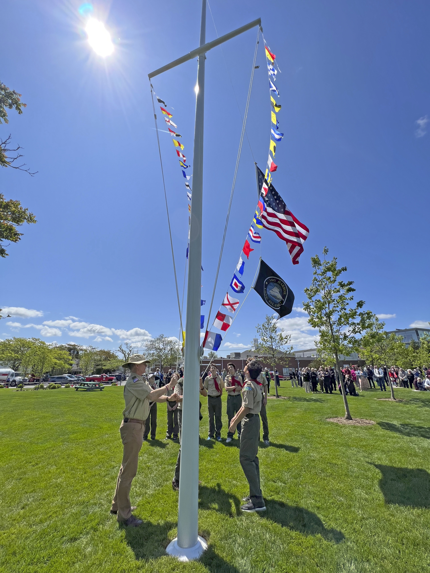 Members of Scout Troop 455 raise the flags for the first time in John Steinbeck Waterfront Park on Thursday.   DANA SHAW