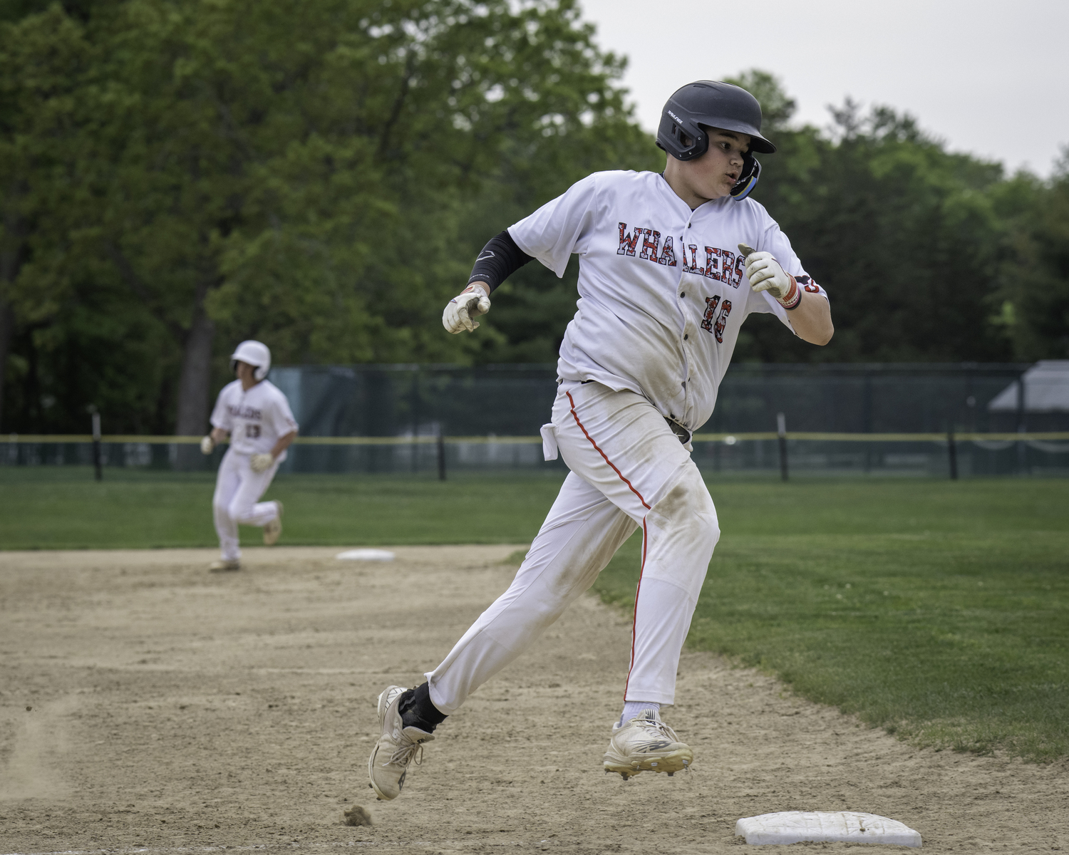Pierson's Paul Roesel rounds third base and heads for home.    MARIANNE BARNETT