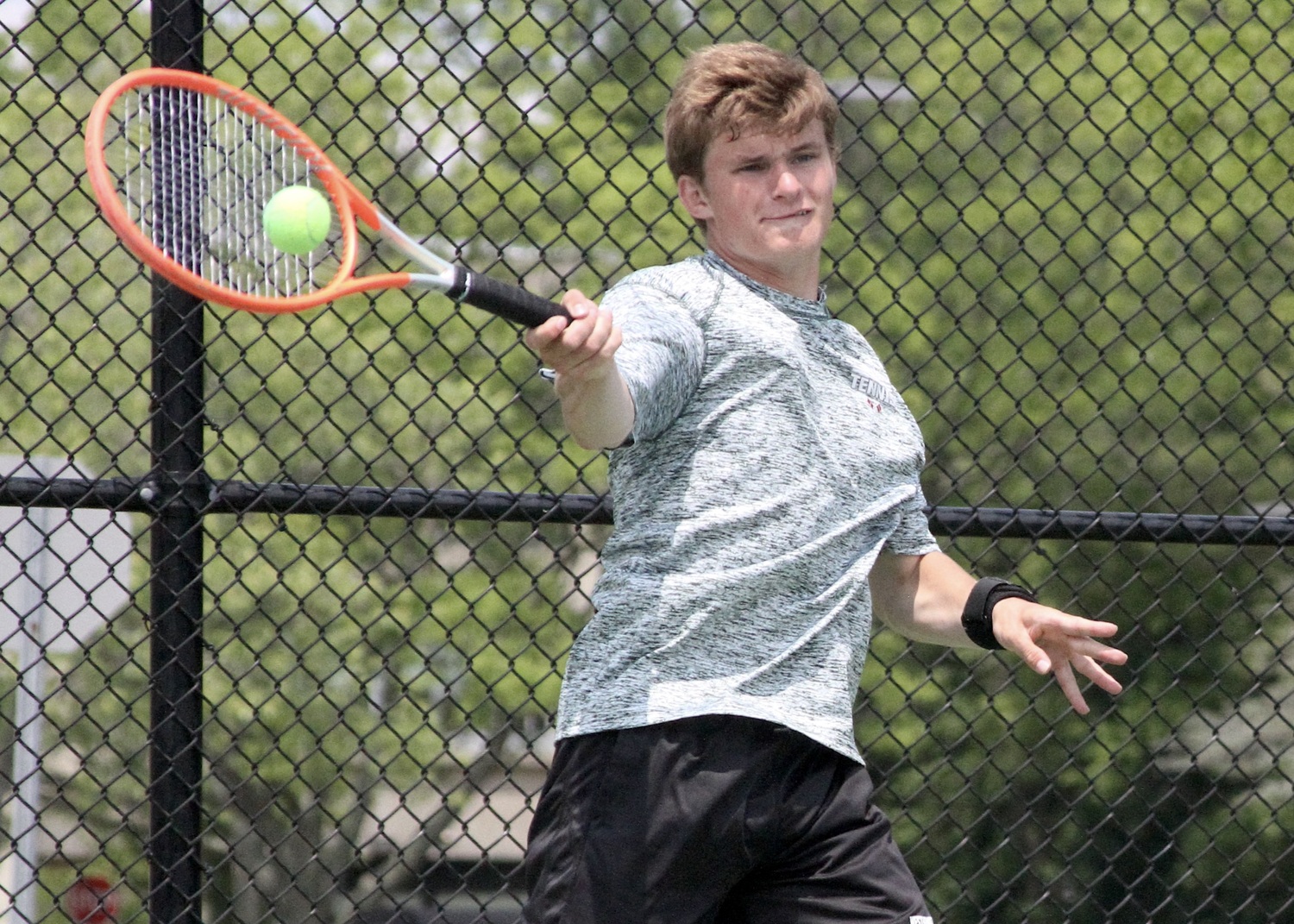 Westhampton Beach junior Bobby Stabile returns a serve. DESIRÉE KEEGAN