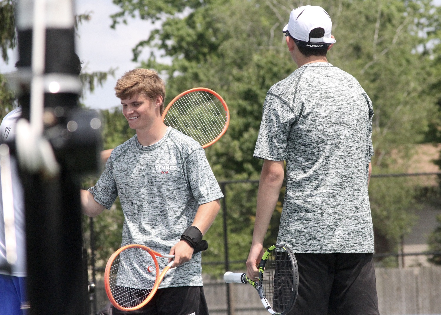Westhampton Beach junior Bobby Stabile is all smiles after his and Giancarlo Volpe's semifinal win. DESIRÉE KEEGAN