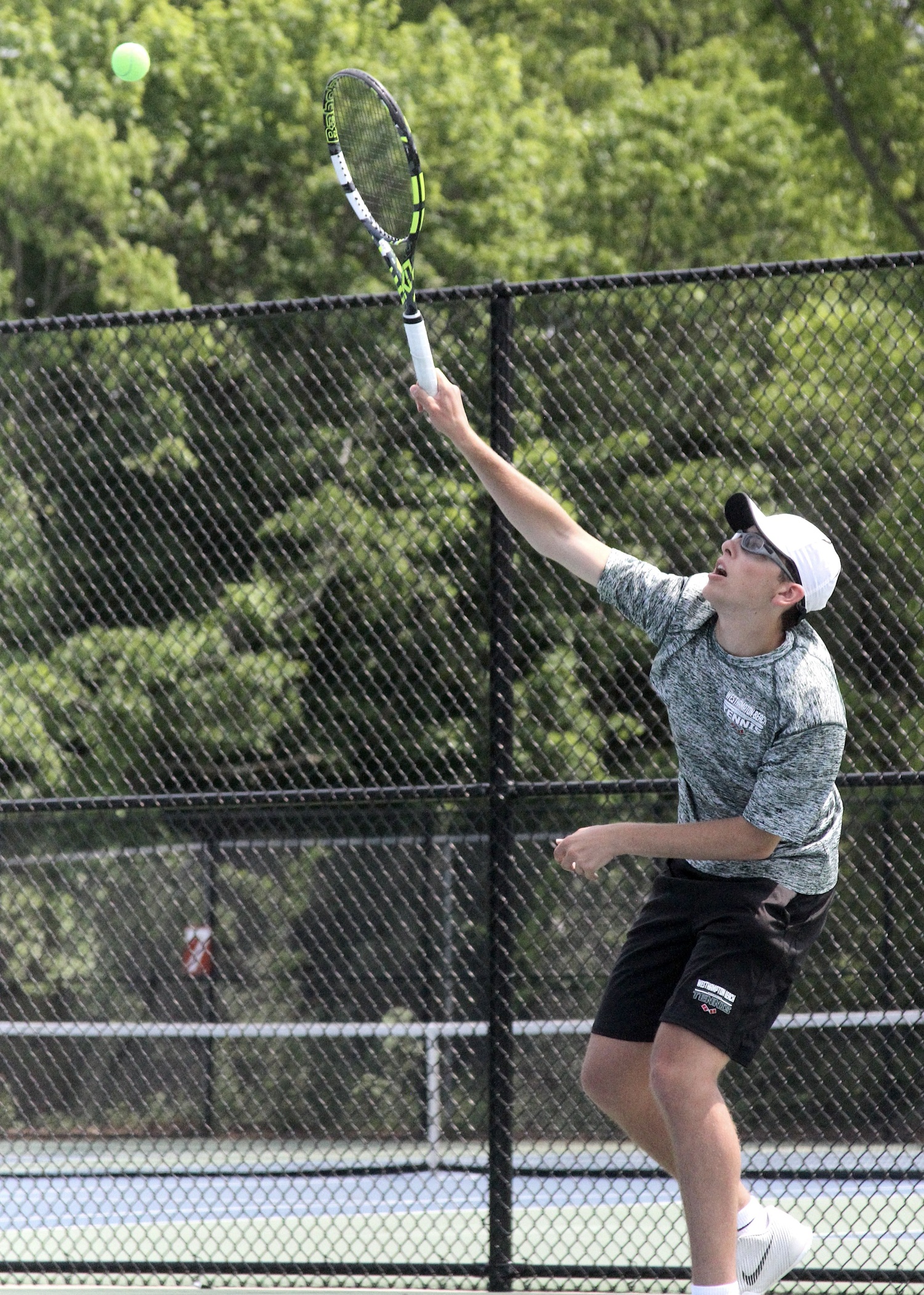 Westhampton Beach sophomore Giancarlo Volpe is steady from the service line. DESIRÉE KEEGAN
